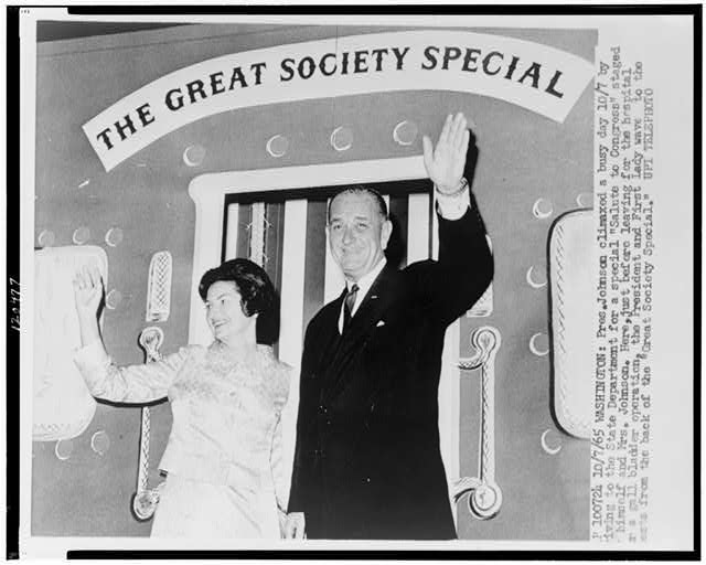 service-pnp-cph-3c20000-3c20000-3c20400-3c20477r.jpg “President Lyndon B. Johnson and Mrs. Johnson wave from the back of the ‘Great Society Special,’” Photograph, 1965. From Library of Congress, Prints and Photographs Division. https://www.loc.gov/item/98504091/